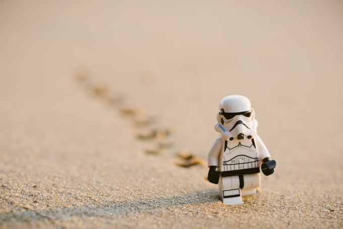 Lego stormtrooper crossing the desert representing data backup